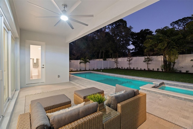 view of pool with an outdoor living space, ceiling fan, an in ground hot tub, and a patio area