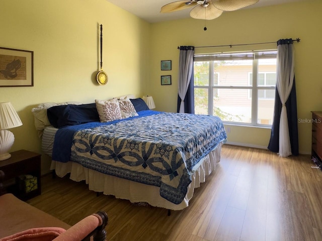 bedroom featuring ceiling fan and light hardwood / wood-style flooring