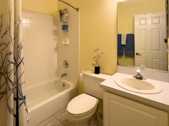 full bathroom with tile patterned flooring, shower / bath combination with curtain, vanity, and toilet