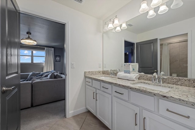 bathroom with tile patterned flooring and vanity