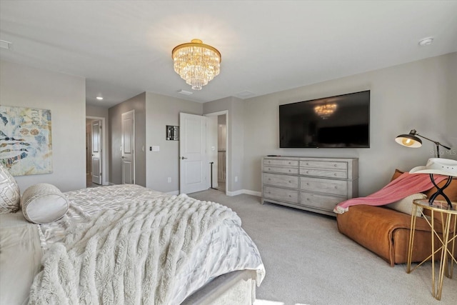 carpeted bedroom with a chandelier