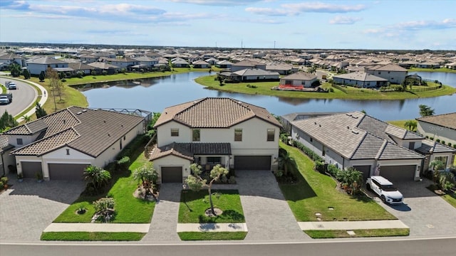 birds eye view of property featuring a water view