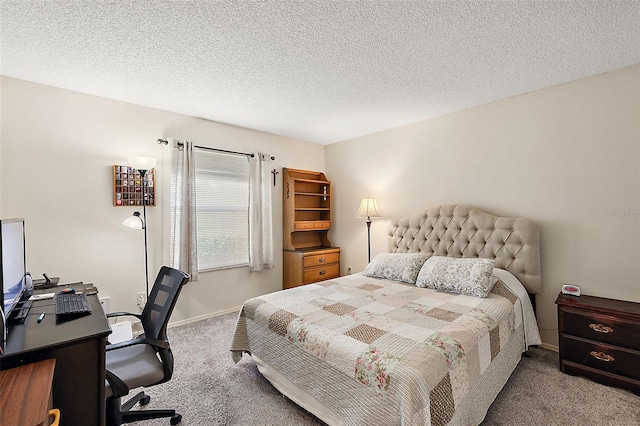 bedroom featuring light colored carpet and a textured ceiling