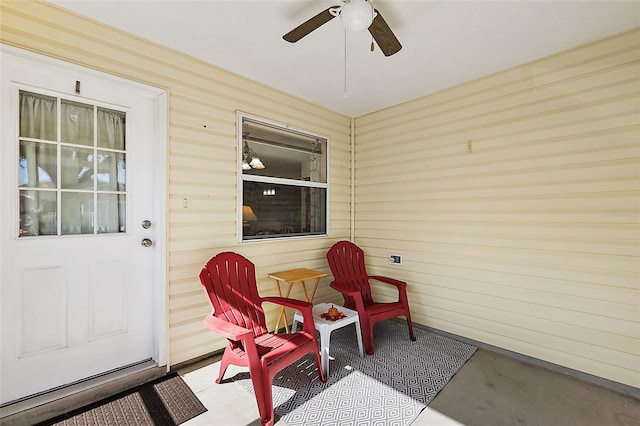 view of patio featuring ceiling fan