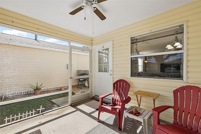 sunroom featuring ceiling fan