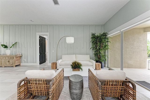 living room featuring a textured ceiling