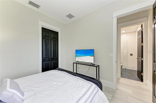 bedroom with a closet and light wood-type flooring