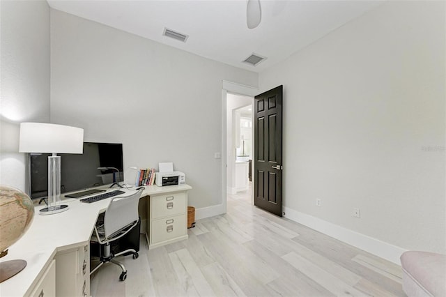 office space with light hardwood / wood-style floors