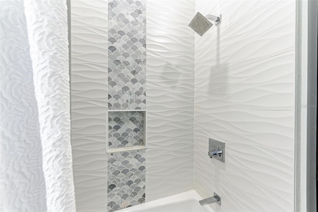 bathroom with a tile shower