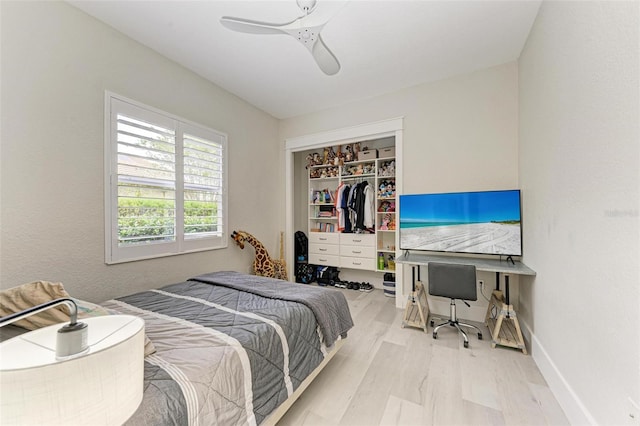 bedroom featuring a closet, ceiling fan, and light hardwood / wood-style flooring