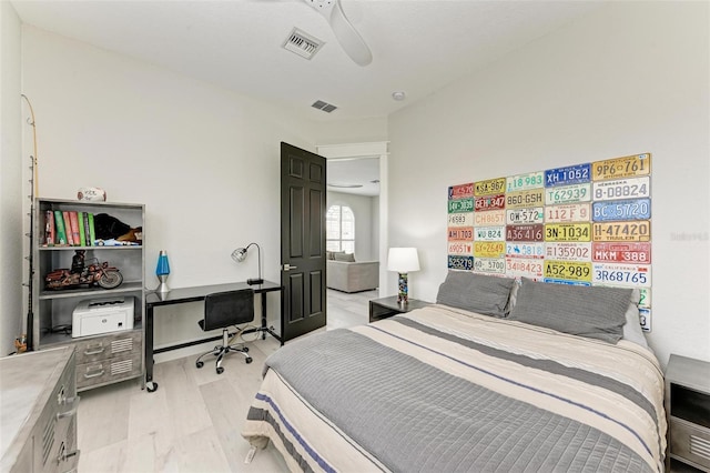 bedroom with ceiling fan and light wood-type flooring