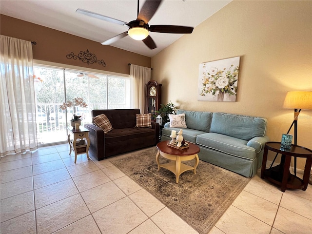 tiled living room with ceiling fan and lofted ceiling