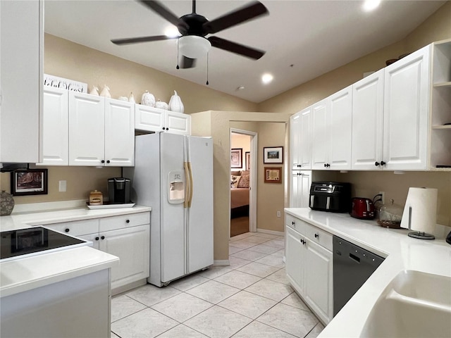 kitchen with ceiling fan, white fridge with ice dispenser, white cabinets, and light tile patterned floors