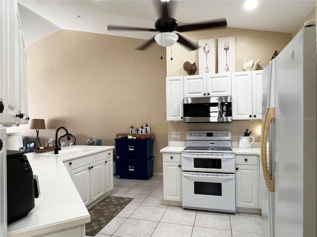 kitchen featuring white cabinets, white appliances, and sink