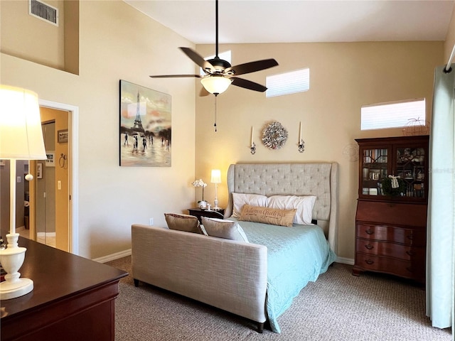 carpeted bedroom with ceiling fan and lofted ceiling