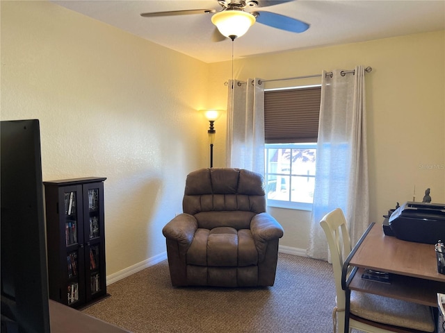 sitting room with carpet flooring and ceiling fan