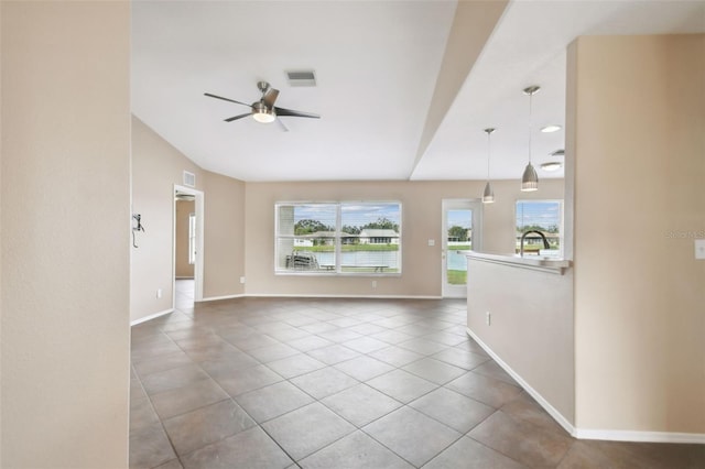 unfurnished living room featuring light tile patterned floors, sink, a wealth of natural light, and ceiling fan