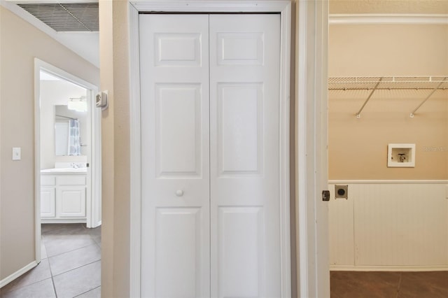 hallway with tile patterned flooring