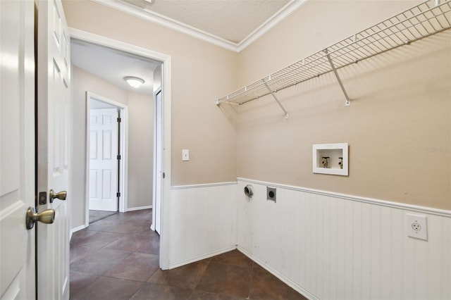 clothes washing area featuring ornamental molding, dark tile patterned floors, electric dryer hookup, washer hookup, and a textured ceiling