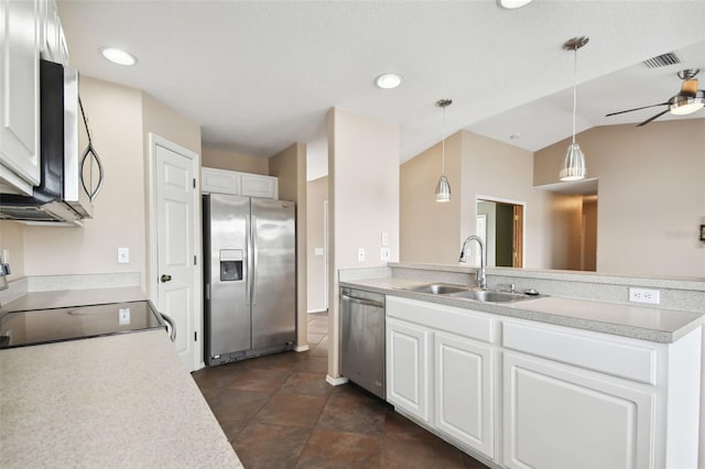 kitchen with white cabinetry, sink, hanging light fixtures, lofted ceiling, and appliances with stainless steel finishes