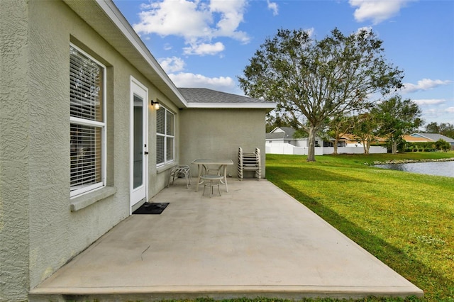 view of patio featuring a water view