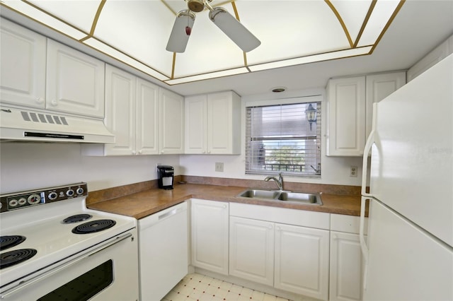 kitchen featuring white appliances, ventilation hood, white cabinets, and sink