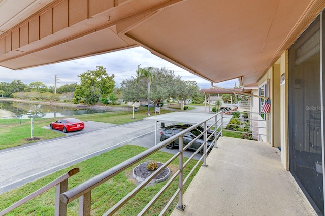 balcony featuring a water view