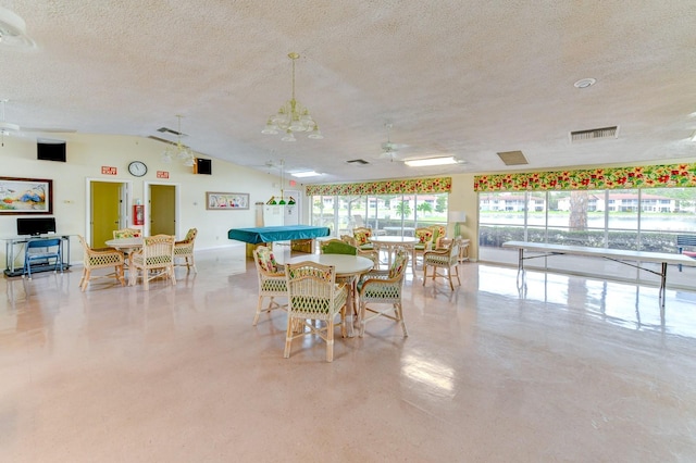 dining space with lofted ceiling, a textured ceiling, and billiards