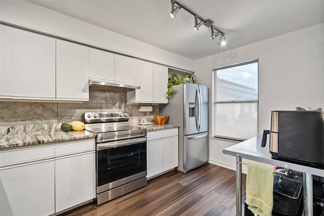 kitchen featuring light stone countertops, appliances with stainless steel finishes, extractor fan, white cabinets, and dark hardwood / wood-style floors