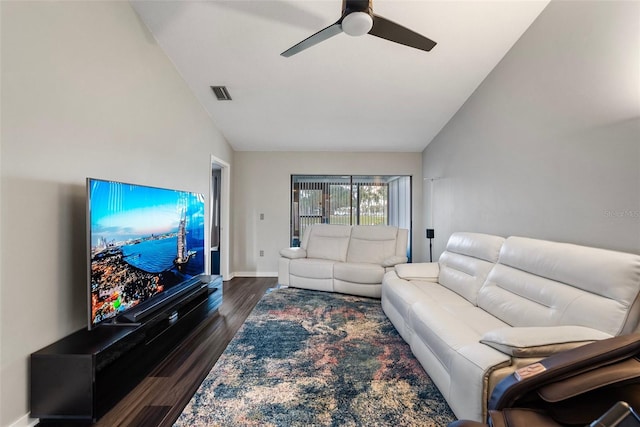 living room featuring dark hardwood / wood-style flooring, ceiling fan, and lofted ceiling