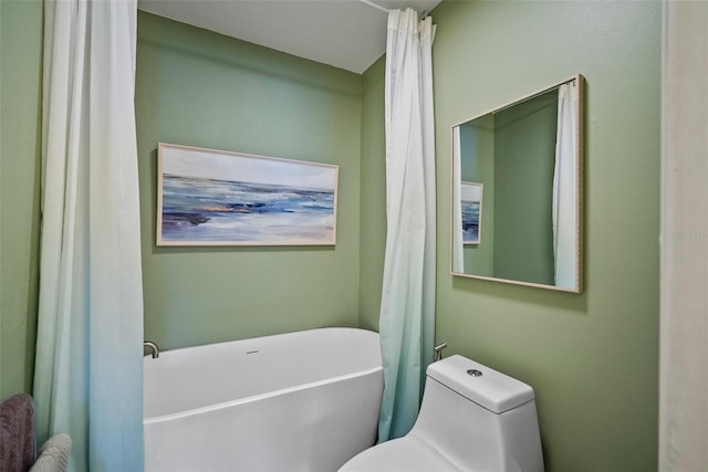 bathroom featuring a bathing tub and toilet