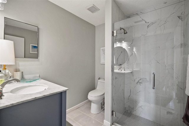 bathroom featuring walk in shower, tile patterned flooring, vanity, and toilet