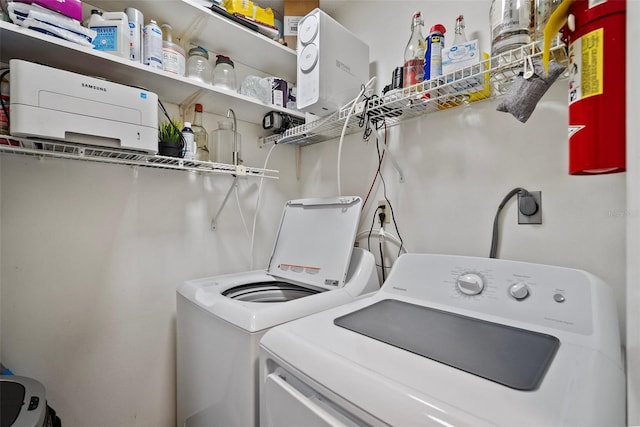 laundry room with washer and dryer