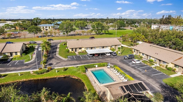 birds eye view of property with a water view