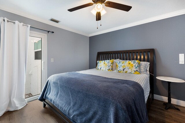 bedroom featuring ceiling fan, dark hardwood / wood-style flooring, and crown molding