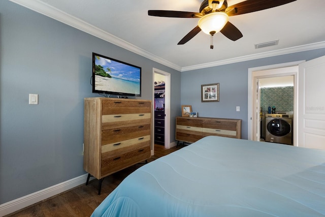 bedroom with crown molding, ceiling fan, dark hardwood / wood-style floors, washer / dryer, and a closet