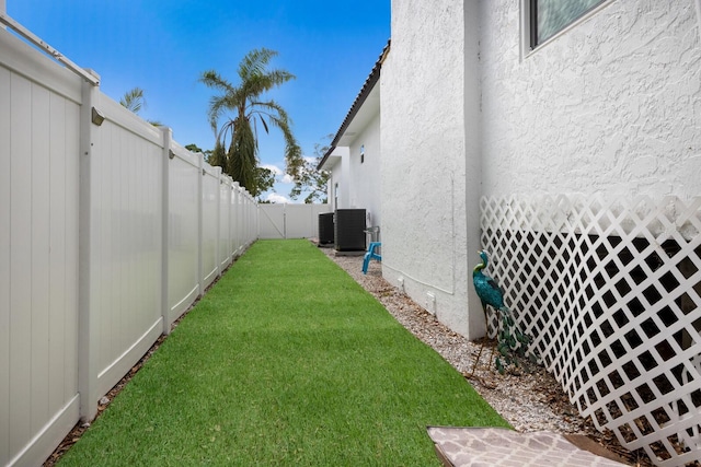 view of yard featuring central AC