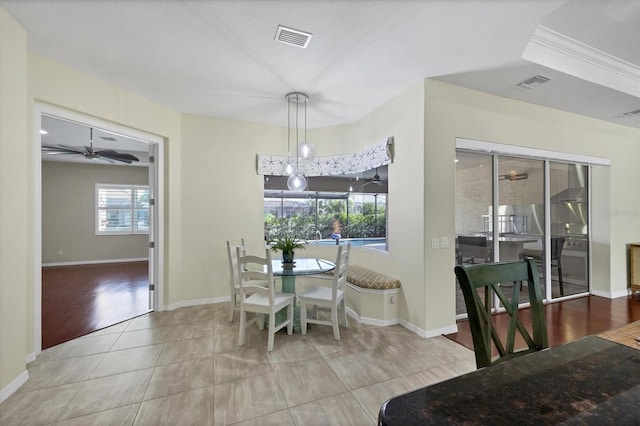 dining room with ceiling fan and wood-type flooring