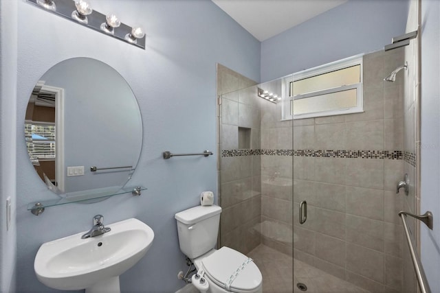 575 Fore Dr, Bradenton, FL 34208 - bathroom with a stall shower, toilet, and a sink