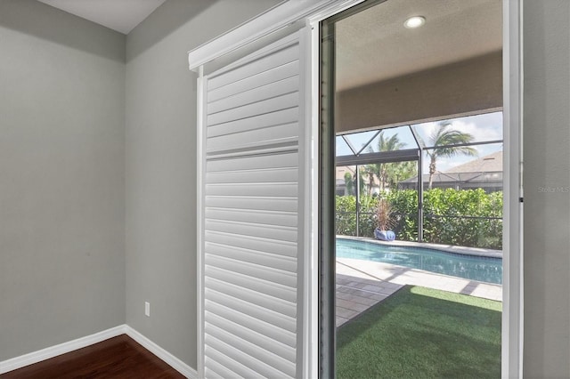 doorway to outside featuring wood-type flooring