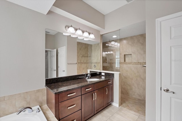 bathroom with tile patterned flooring, vanity, and independent shower and bath