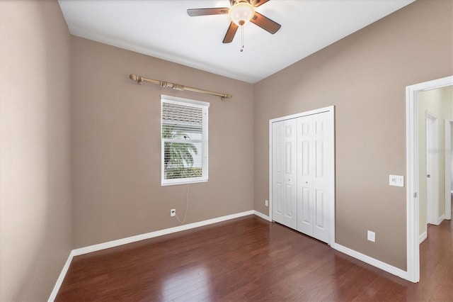 575 Fore Dr, Bradenton, FL 34208 - unfurnished bedroom featuring dark wood-style floors, baseboards, and a closet