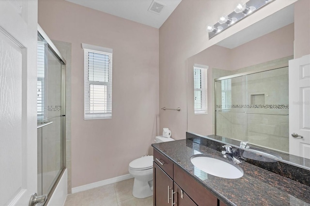 575 Fore Dr, Bradenton, FL 34208 - full bathroom with healthy amount of natural light, toilet, vanity, and tile patterned floors