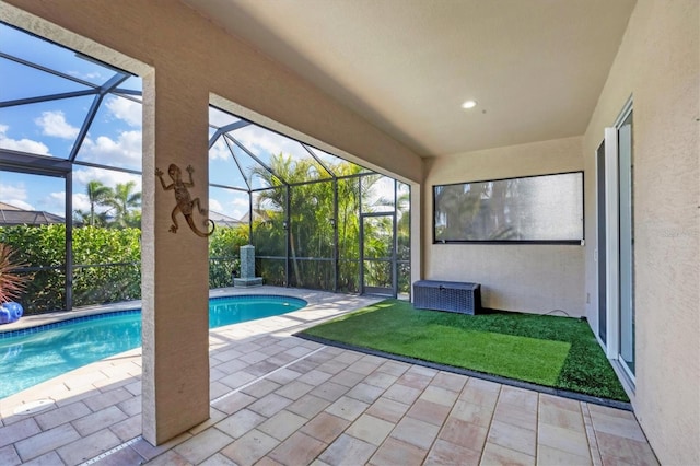 view of swimming pool with a lanai and a patio area