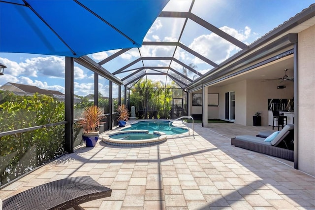 575 Fore Dr, Bradenton, FL 34208 - view of swimming pool featuring a patio, a pool with connected hot tub, glass enclosure, and ceiling fan