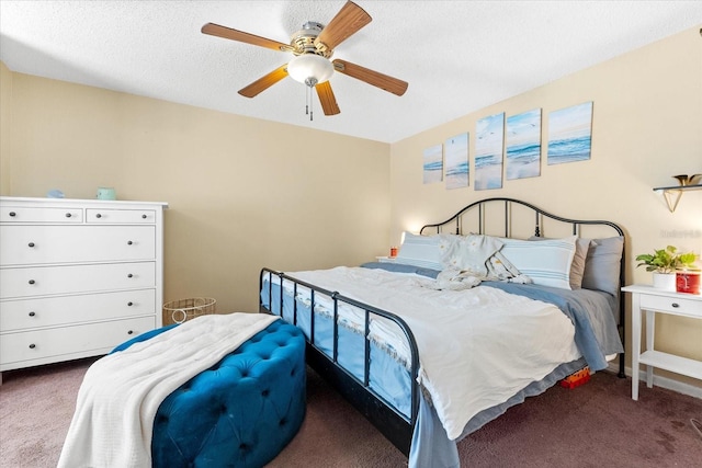 carpeted bedroom featuring a textured ceiling and ceiling fan