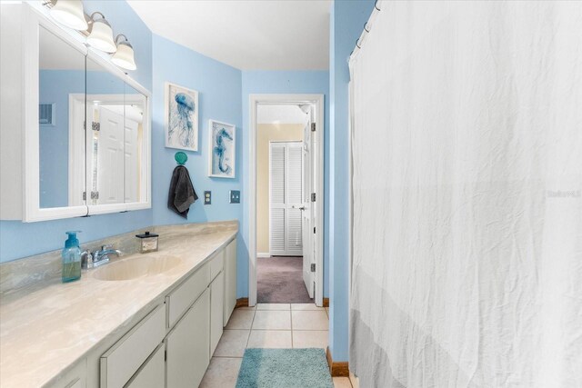 bathroom with vanity and tile patterned floors