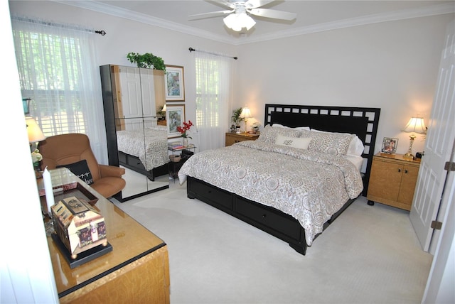 carpeted bedroom with ornamental molding, multiple windows, and ceiling fan