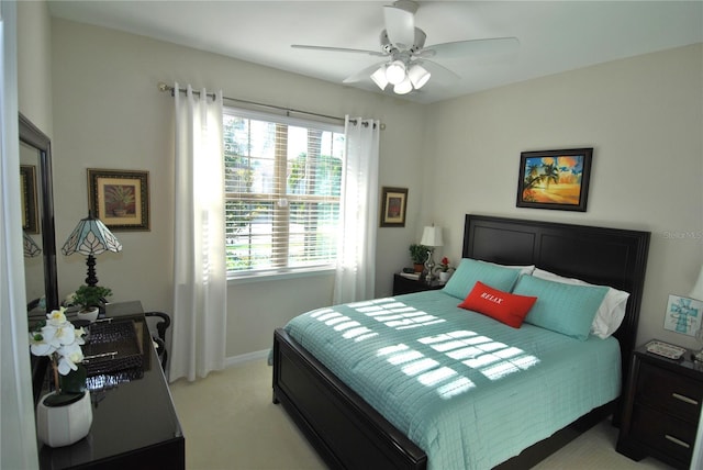 bedroom with light carpet and ceiling fan