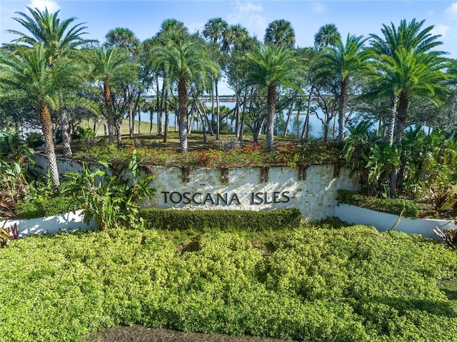 community sign with a water view